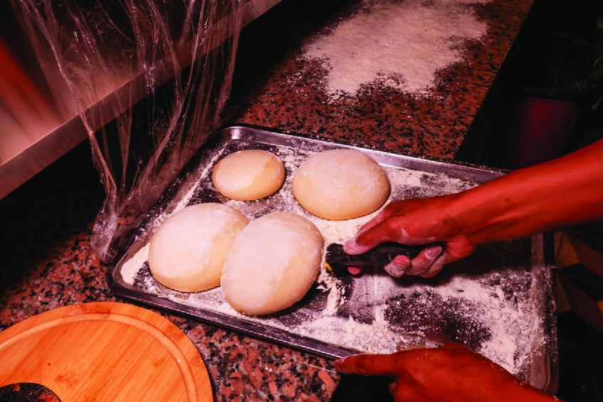 Fresh pizza dough balls resting at Mr. CIAO
