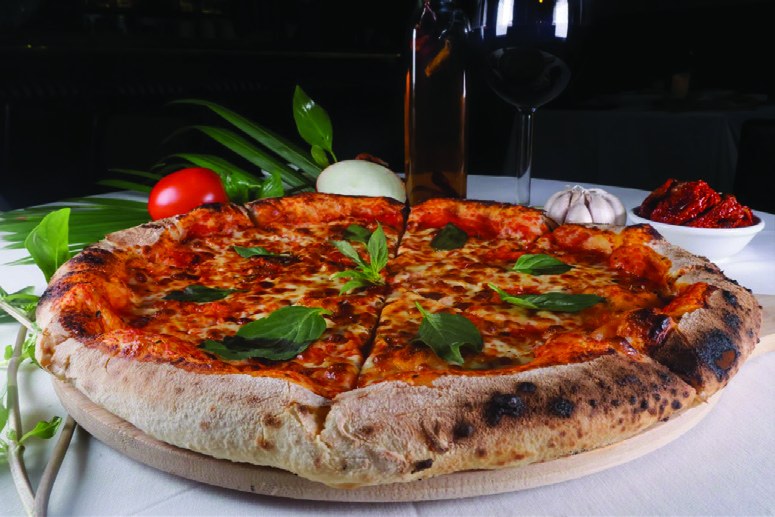 Wood-fired Margherita pizza at Mr. CIAO with leopard-spotted crust